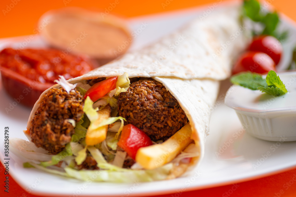 Falafel sandwich on a dish Falafel sandwich on a dish