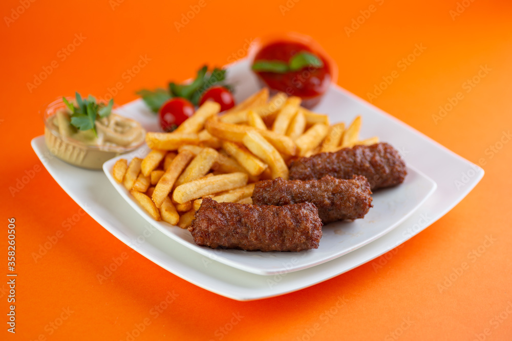 Traditional Romanian Dinner With Meatballs Or Mici And French Fries Traditional Romanian Dinner With Meatballs Or Mici And French Fries