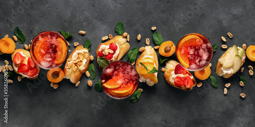 Fotografi Summer drink with various fruit bruschetta dark background top view Delicious ap