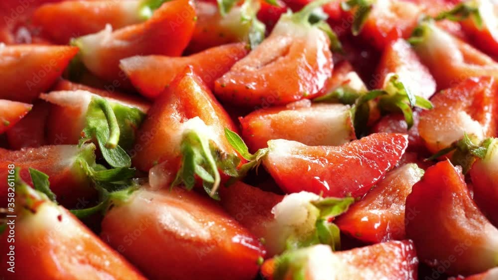 strawberry strawberries sliced into quarters turn turning round rotating strawberry strawberries sliced into quarters turn turning round rotating