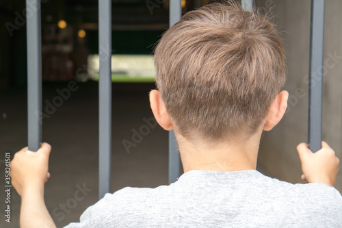 young supporter watching a foorball game - social distancing