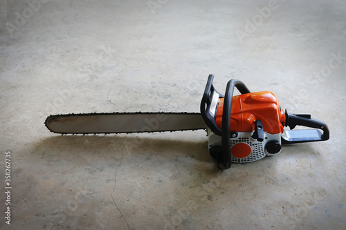 Small chainsaw on the ground