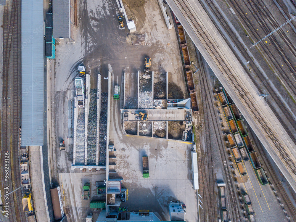 Aerial view of recycling sorting station with garbage truck in industrial area.