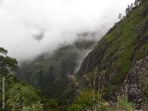Fog, mist and dark clouds covered mountains