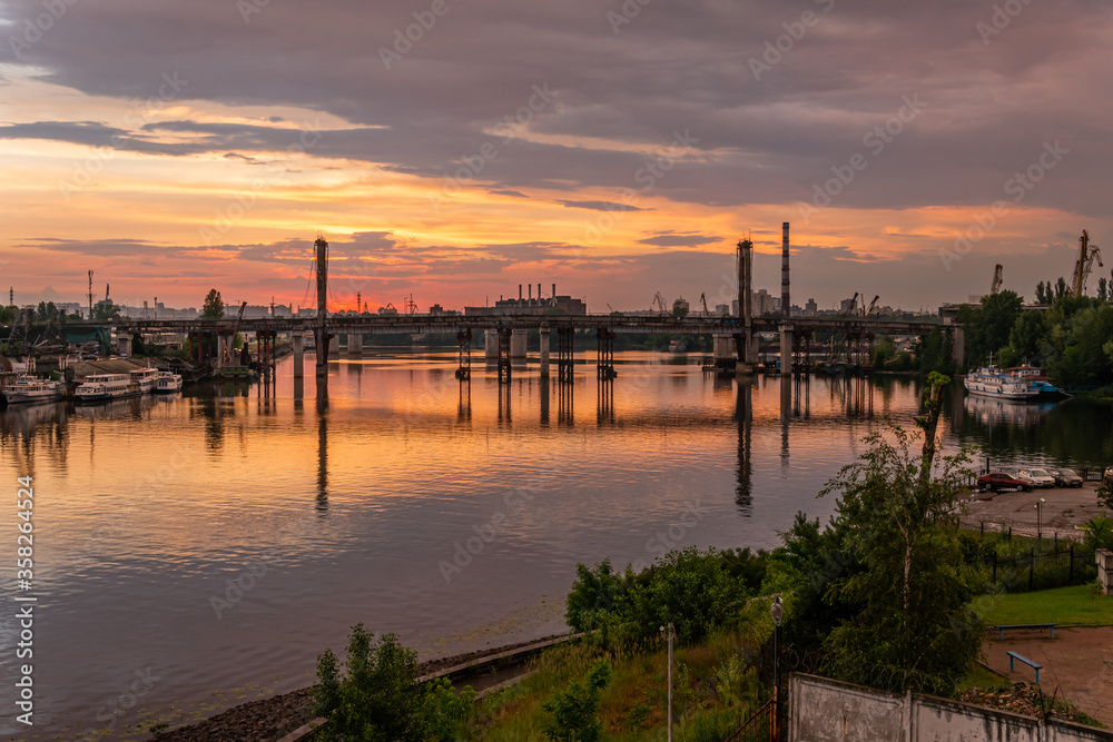 Kiev (Kyiv), Ukraine - June 15, 2020: Dnipro river and industrial area during the sunset