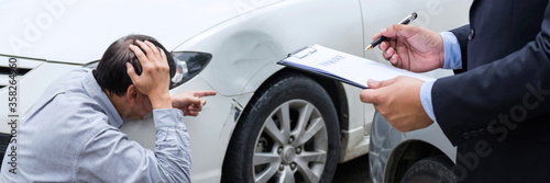 Fotografie Traffic Accident and insurance concept, Insurance agent working on report form w