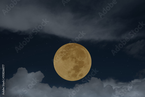 Full moon with blurred cloud on the sky.