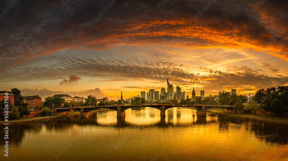 Panaroma high definition sunset photo of the Frankfurt Skyline with a bridge across the river main