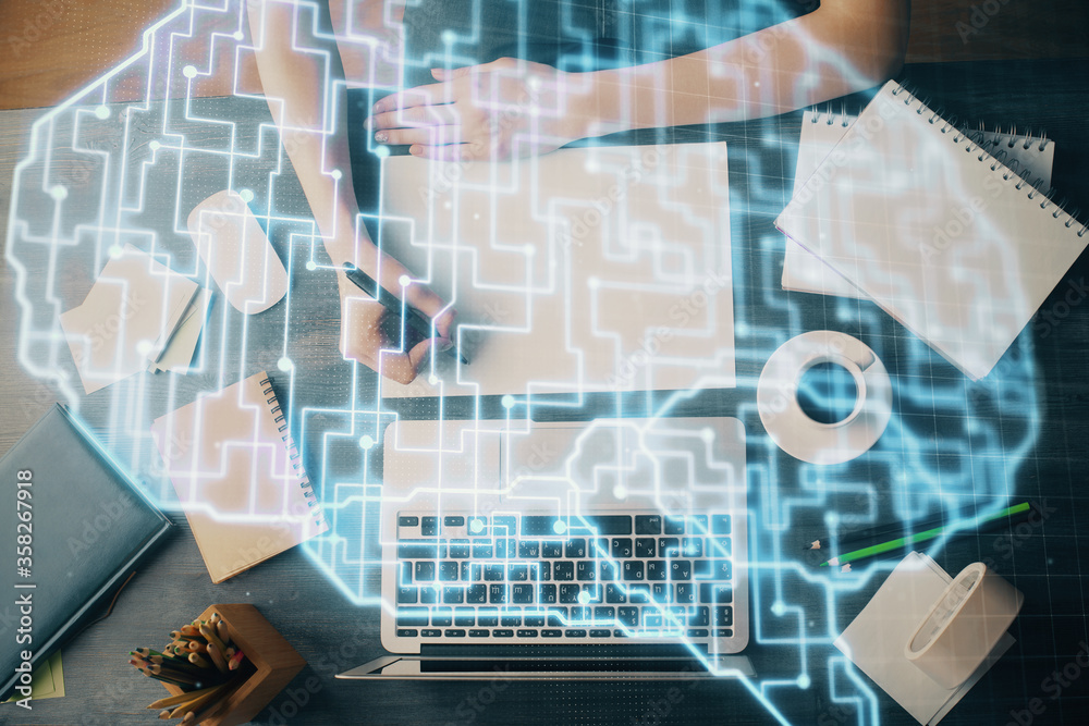 Multi exposure of writing hand on background with brain hologram. Concept of learning. Multi exposure of writing hand on background with brain hologram. Concept of learning.