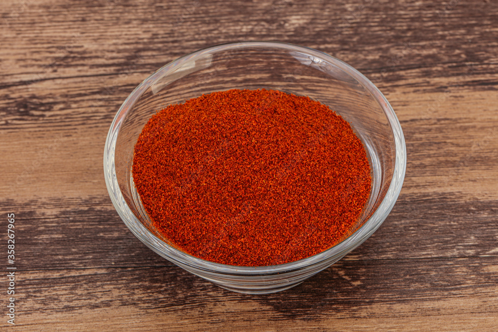Dry paprika powder in the bowl Dry paprika powder in the bowl