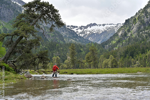 fly fisherman in the high mountains