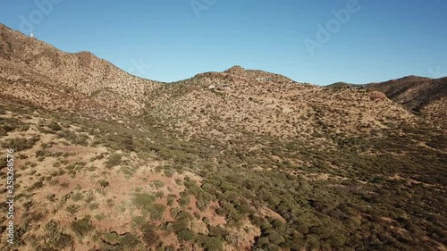 4K aerial drone video of Africa savanna hills, mansions and houses up n the mountains south of Windhoek in central highland Khomas Hochland of Namibia, southern Africa photo