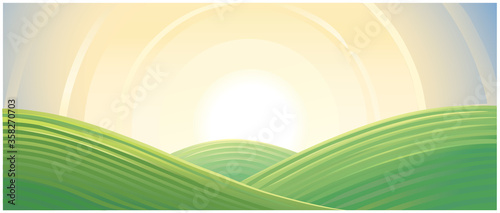 Hilly landscape, sunrise above hills.