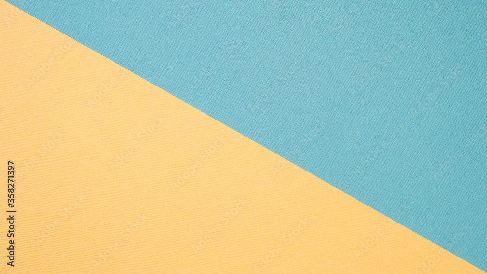 Textural background in trendy pastels: grey and rich yellow in a minimalistic concept. Flat lay, top view Textural background in trendy pastels: grey and rich yellow in a minimalistic concept. Flat lay, top view