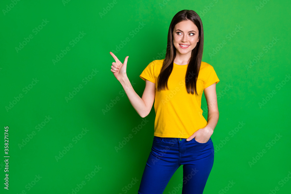 Portrait of positive cheerful girl promoter point index finger copyspace present adverts promo recommend suggest select discount wear trousers isolated over shine color background Portrait of positive cheerful girl promoter point index finger copyspace present adverts promo recommend suggest select discount wear trousers isolated over shine color background