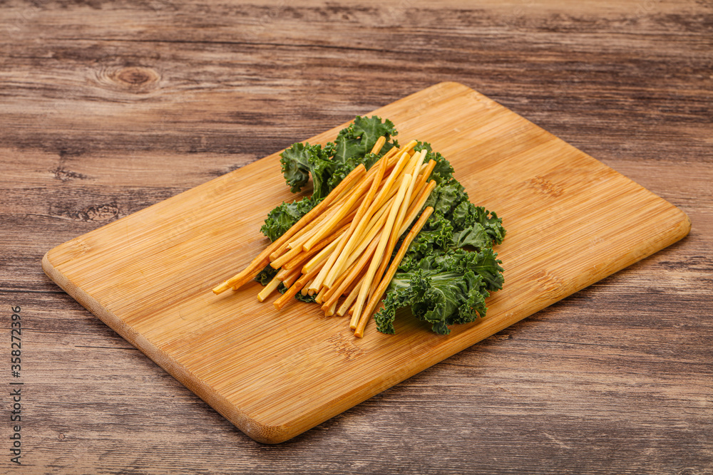 Chechel cheese sticks over board Chechel cheese sticks over board