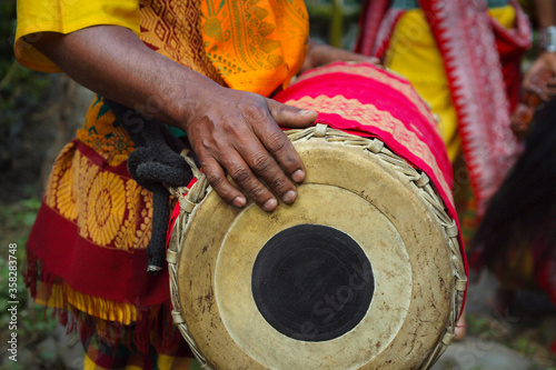  naga man playing drum , during hornbill festival in kohima -nagalang-india
 photo