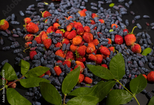 many berries on the table. Strawberry