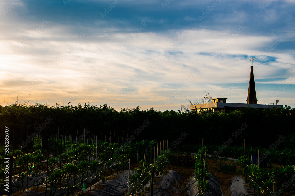 A rural Korean church in the farmland of Goyang, South Korea during a beautiful summer evening. 