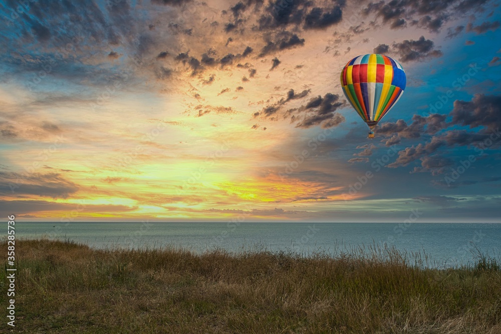 Balloon soars against the blue sky