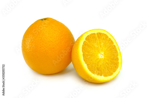 Orange fruit with orange slices isolated on the white background.
