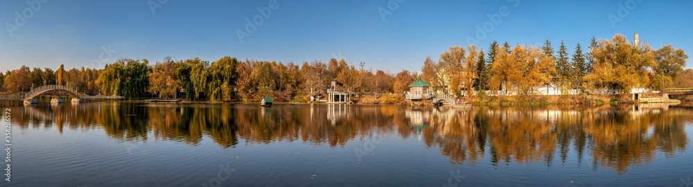 Autumn landscape with a lake and yellow trees