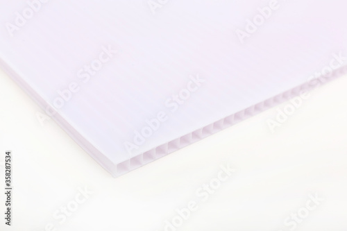 Polycarbonate plastic sheets panels images. PC hollow sheet for translucent roofing close up. Single white color on white background