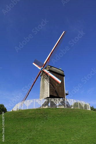 BRUGGE,BELGIUM AUG 12 2017 windmill with blue sky background in Brugge, Belgium © Sami