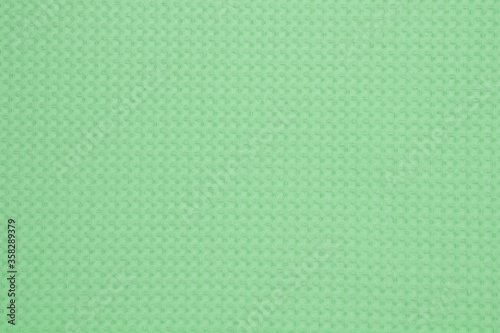 Fabric cotton fold, top view. Green textile
