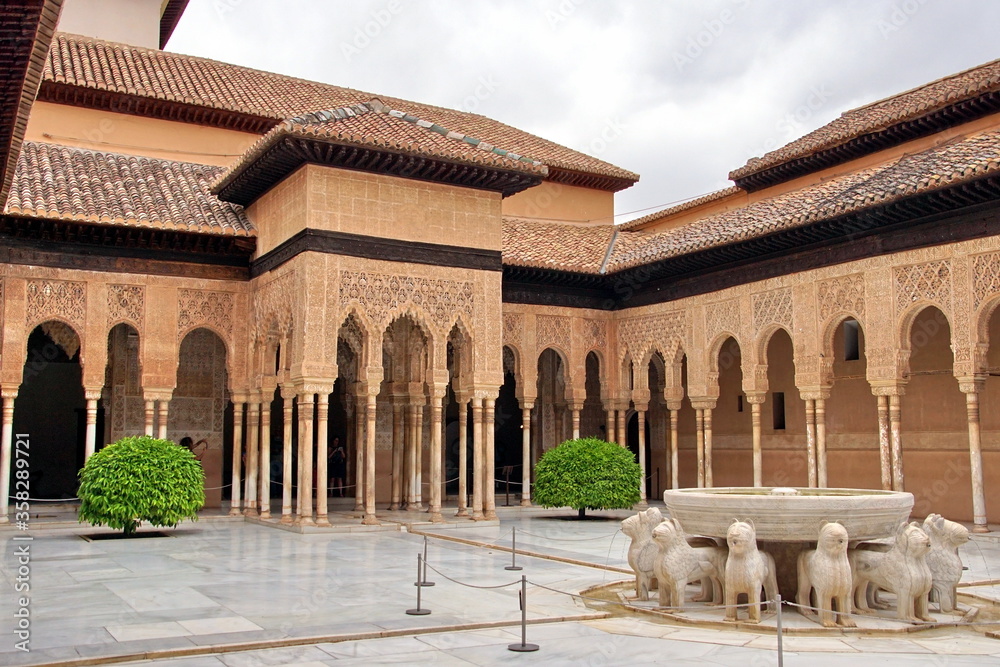 Patio of the Lions is a famous courtyard in the middle of the Lion Palace of the Nasrid dynasty in the Alhambra residence.