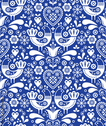 Scandinavian seamless folk art pattern with birds and flowers, Nordic floral design, retro background in white on navy blue 
