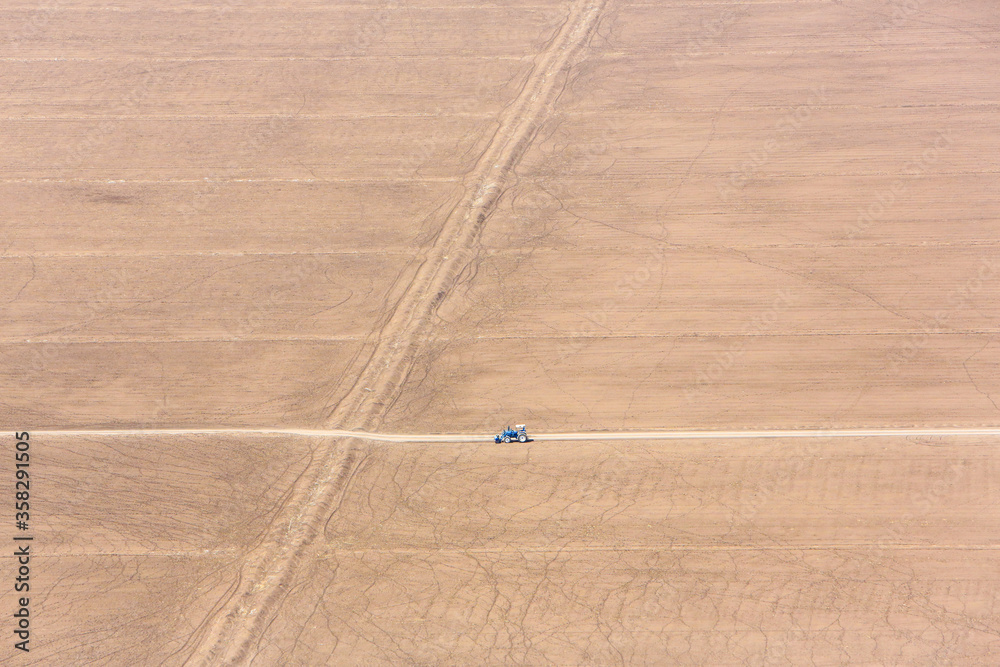 Obraz premium Aerial view of dry farming fields in the Great Rift Valley in Kenya. The Great Rift Valley is part of an intra-continental ridge system that runs through Kenya from north to south.