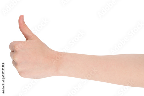 Hand gesture - thumbs up, isolated on a white background. female palms indicate something, blank for your design. © Alexey