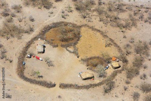 Traditional Masai dwelling in the Great Rift Valley, Kenya. The Great Rift Valley is part of an intra-continental ridge system that runs through Kenya from north to south. photo