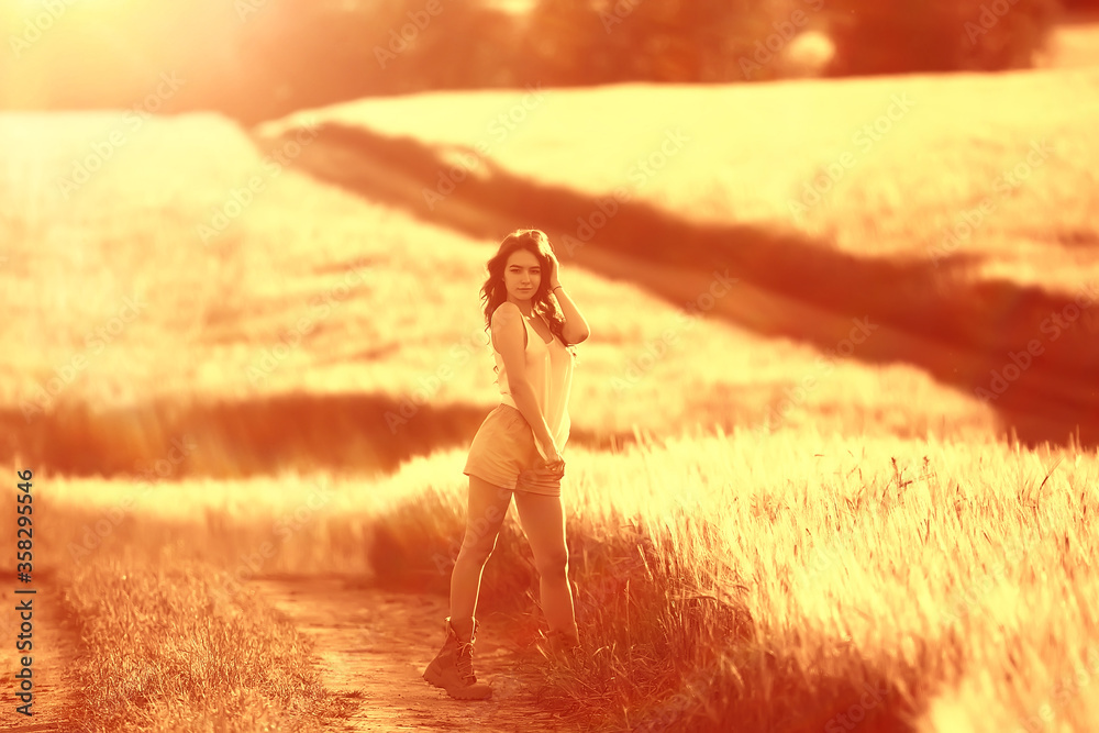 happy young adult model in yellow wheat field / summer happiness concept girl in the field happy young adult model in yellow wheat field / summer happiness concept girl in the field