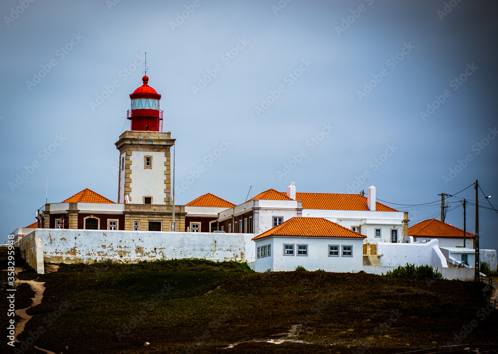 large lighthouse by the ocean. beautiful lighthouse