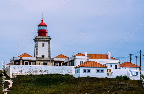 large lighthouse by the ocean. beautiful lighthouse