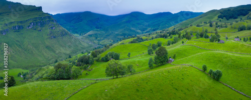 Aerial view with a drone of the spring landscape of pasiegas cabins and meadows in the Miera Valley in the Autonomous Community of Cantabria. Spain  Europe