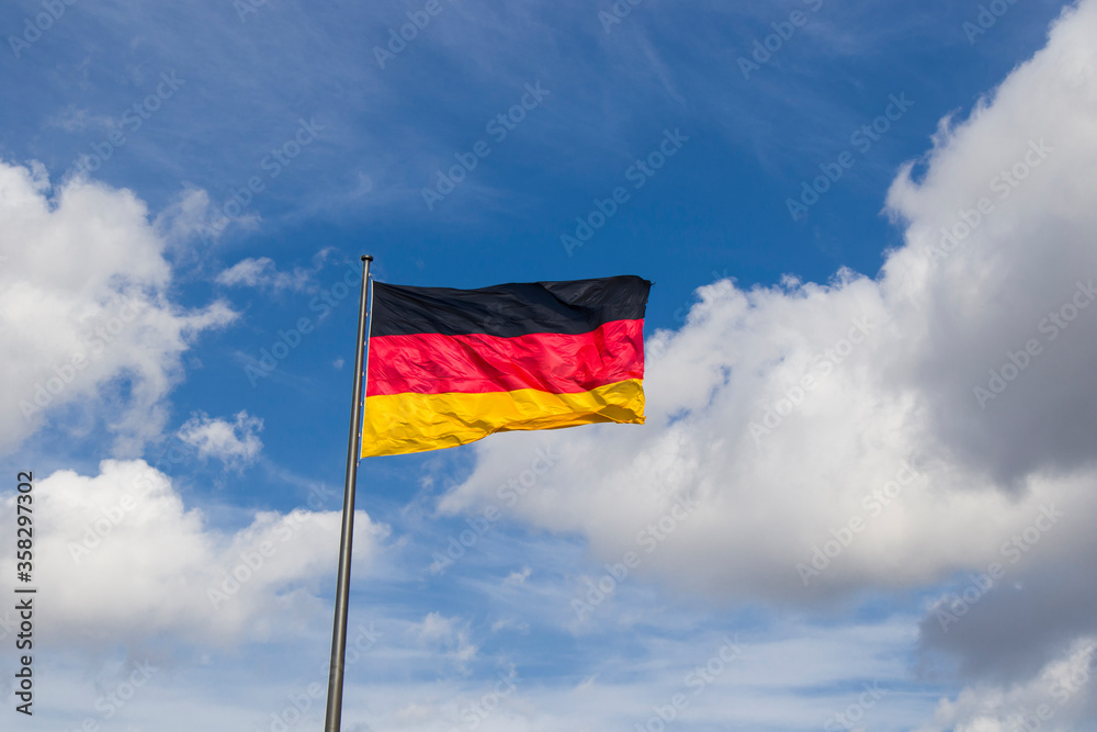 Germany flag on the blue sky background, Berlin Germany flag on the blue sky background, Berlin