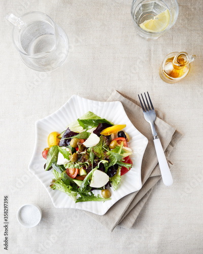 Vegetarian salad with fresh greenery and vegetables