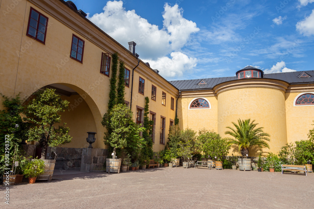 Uppsala, Sweden - 16 June 2019: View on beautiful inner yard of The Linneanum Building, The Orangery of the Botanical Gardens of Uppsala.