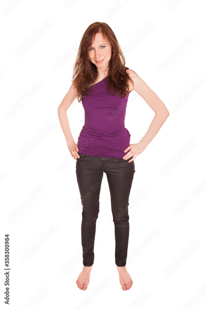 Full length fashion portrait of beautiful girl wearing black jeans and purple top, isolated on white background Full length fashion portrait of beautiful girl wearing black jeans and purple top, isolated on white background