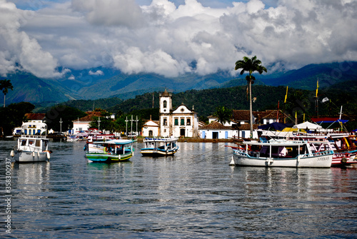 bay in paraty with boats and church
