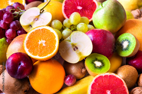 Fototapeta Naklejka Na Ścianę i Meble -  Fresh fruit, orange, apple, kiwi, grapes and other fruits