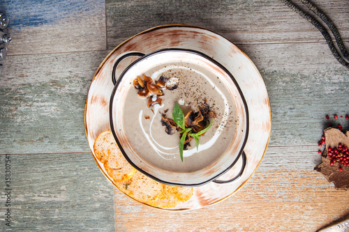 Gourmet mushroom cream soup with croutons  photo