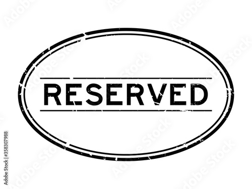 Grunge black reserved word oval rubber seal stamp on white background