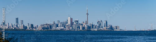 A panoramic view of Toronto  Ontario  Canada  and Lake Ontario  on a summer day with blue and clear sky 