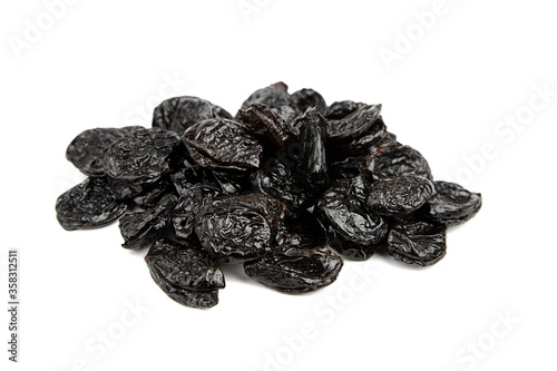 Prunes, dry plums isolated on white background. Heap of dried fruits