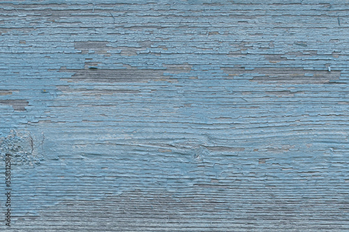 old wooden board with peeling blue paint