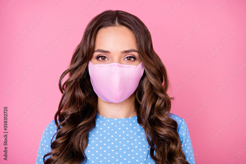 Close-up portrait of her she attractive lovely pretty wavy-haired lady wearing safety reusable cotton textile mask contamination 2019-ncov flu grippe syndrome isolated pink pastel color background Close-up portrait of her she attractive lovely pretty wavy-haired lady wearing safety reusable cotton textile mask contamination 2019-ncov flu grippe syndrome isolated pink pastel color background